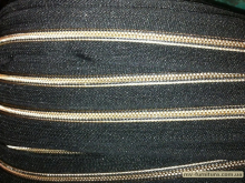 Молния т7 рулонка (200м) золото Молния т7 рулонка (200м) золото